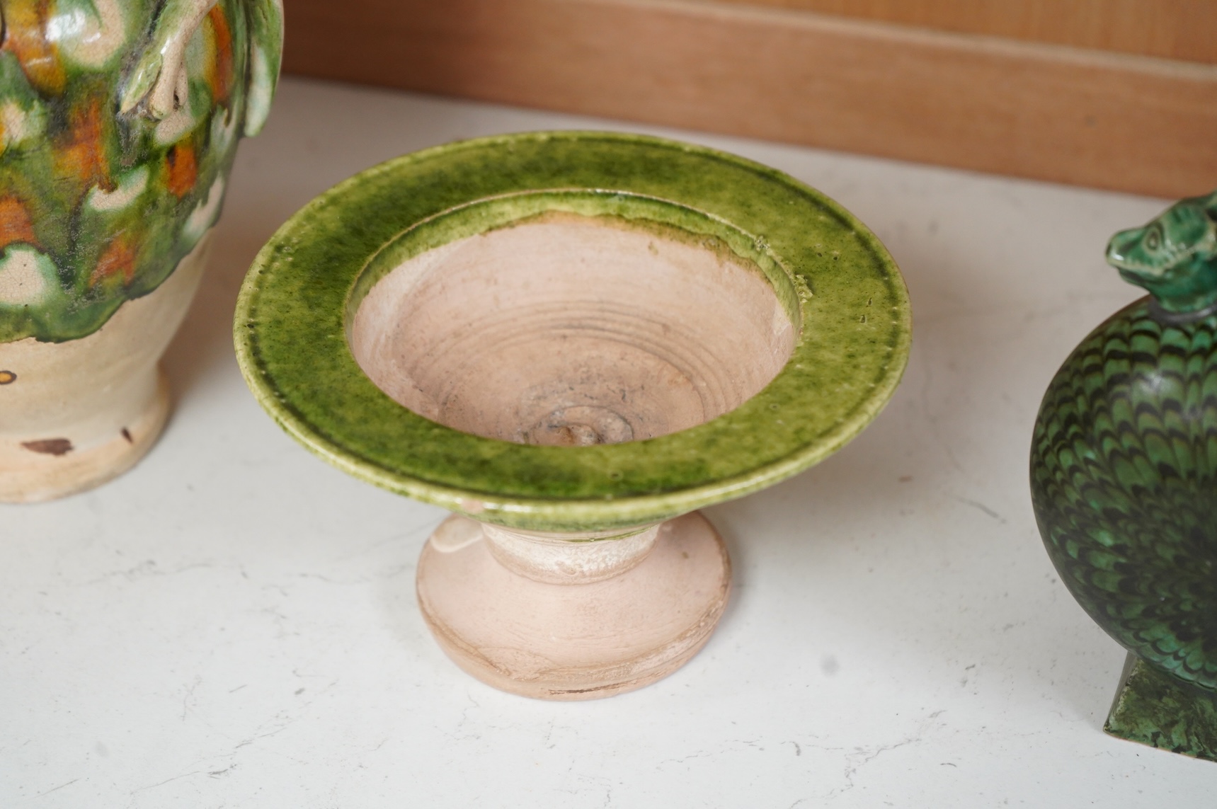 A Chinese agate ware flask, a sancai ewer and a stem dish, largest 26cm high